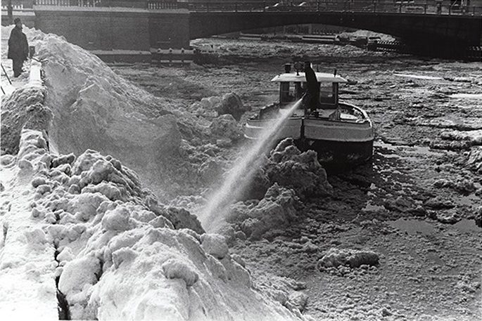 Clearing snow-ice along Milwaukee River