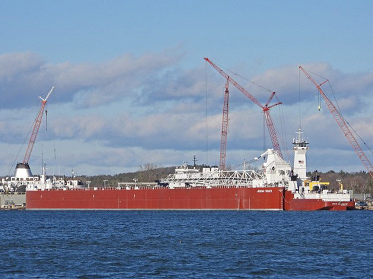 MICHIGAN TRADER, is shown with the tug DIRK S. VANENKEVORT